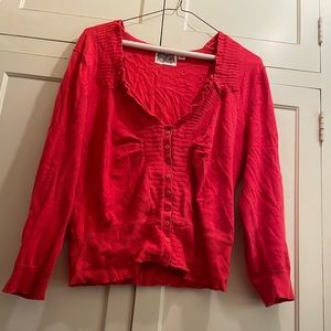 Rosie Neira orange cardigan